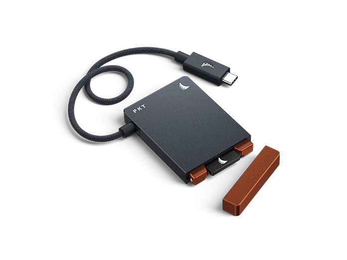 CFexpress A Card Reader PKT wit grey body and rest red cap with USB 3.2 Cable displayed on a neutral background