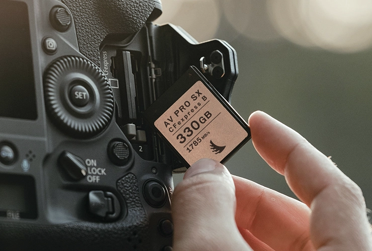 CFexpress B SX 330 GB memory card being inserted in a camera