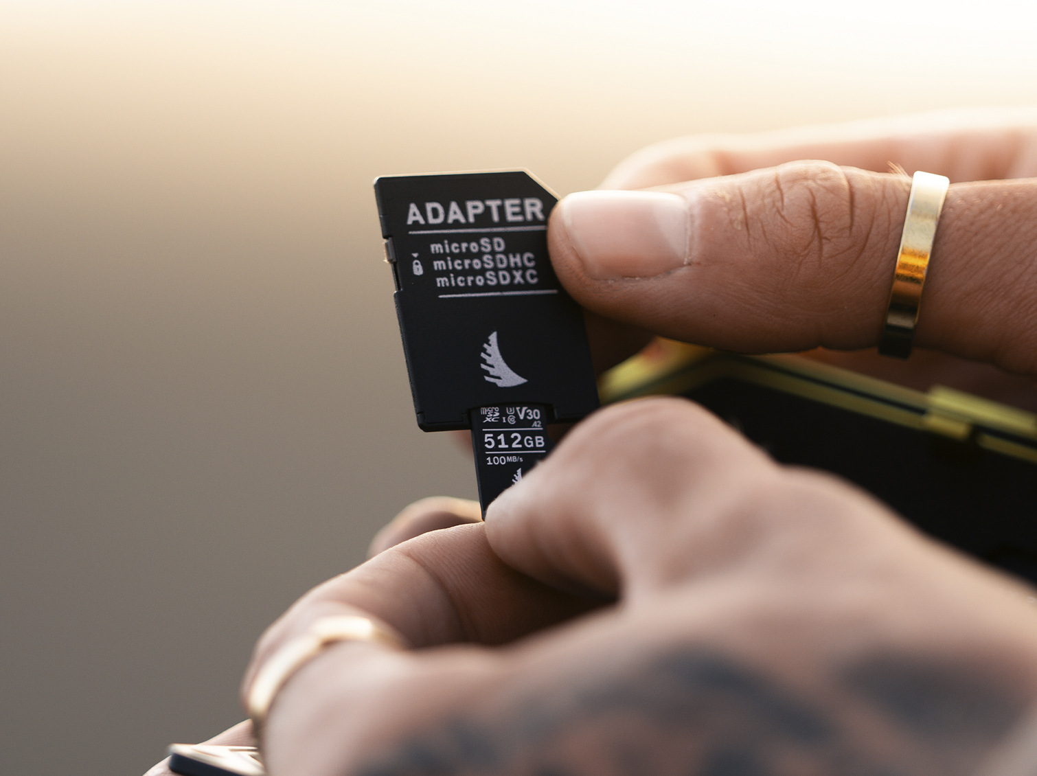 microSD V30 memory card being inserted in a SD memory card adapter