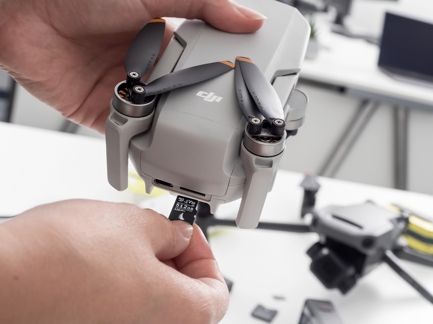 microSD V30 memory card being inserted in a drone