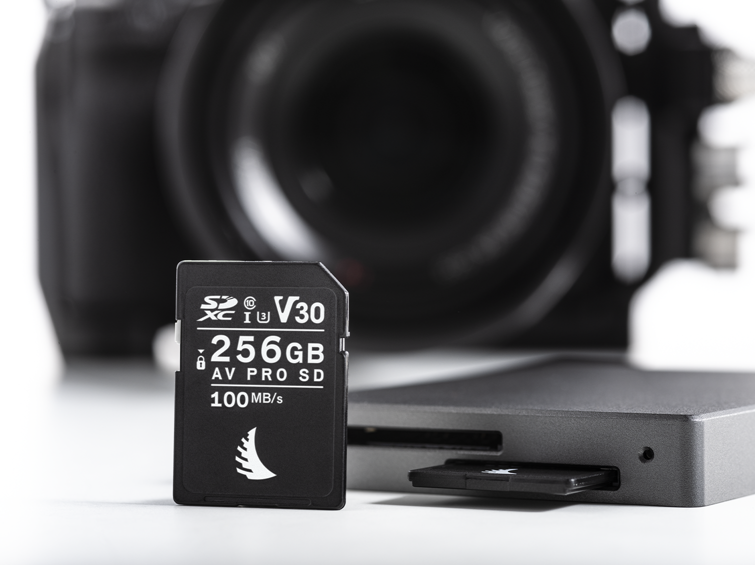 AV PRO SD V30 256 GB memory card on front view with a blurred camera in the background