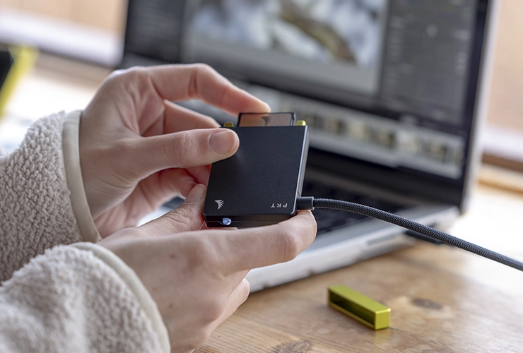AV PRO SE CFexpress B v4 memory card being inserted on an Angelbird Card reader PKT