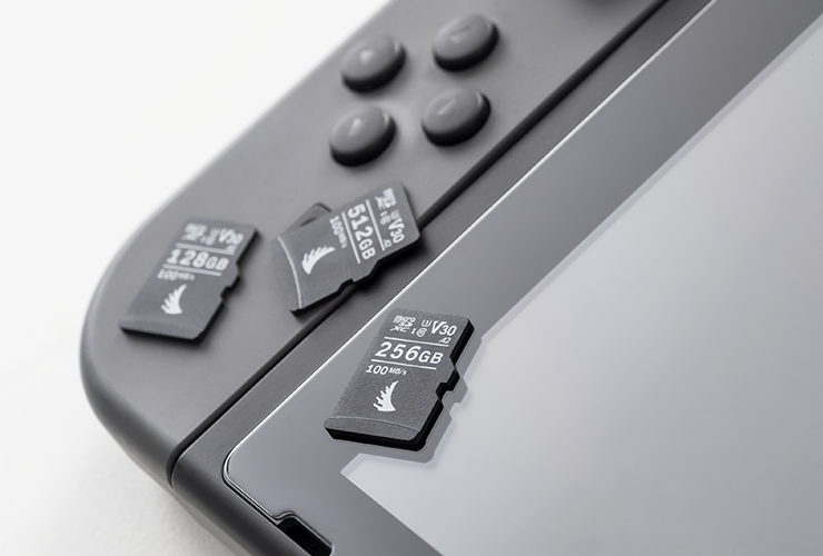 3 microSD V30 memory cards on top of a gaming console