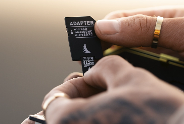 microSD V30 memory card being inserted in a SD memory card adapter