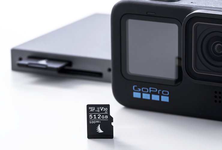 microSD v30 memory card next to an action camera