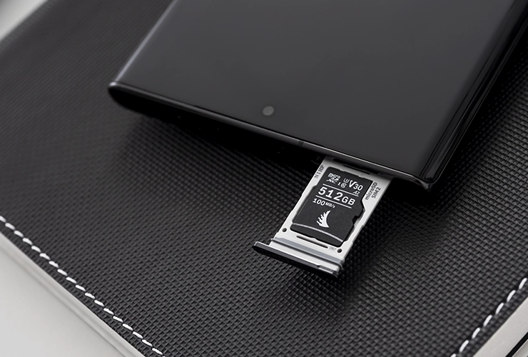 microSD V30 memory card inserted in the memory tray of a smartphone
