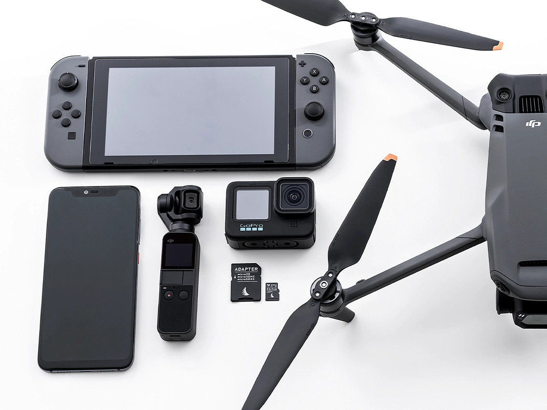 AV PRO microSD V30 memory card placed next to several devices